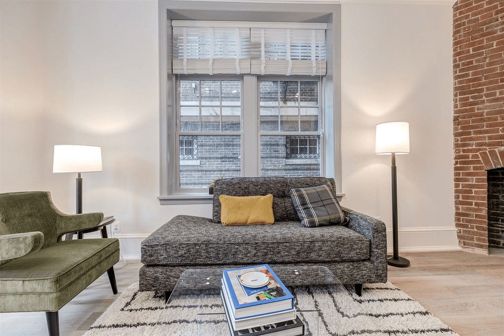 a living room with a couch and a window